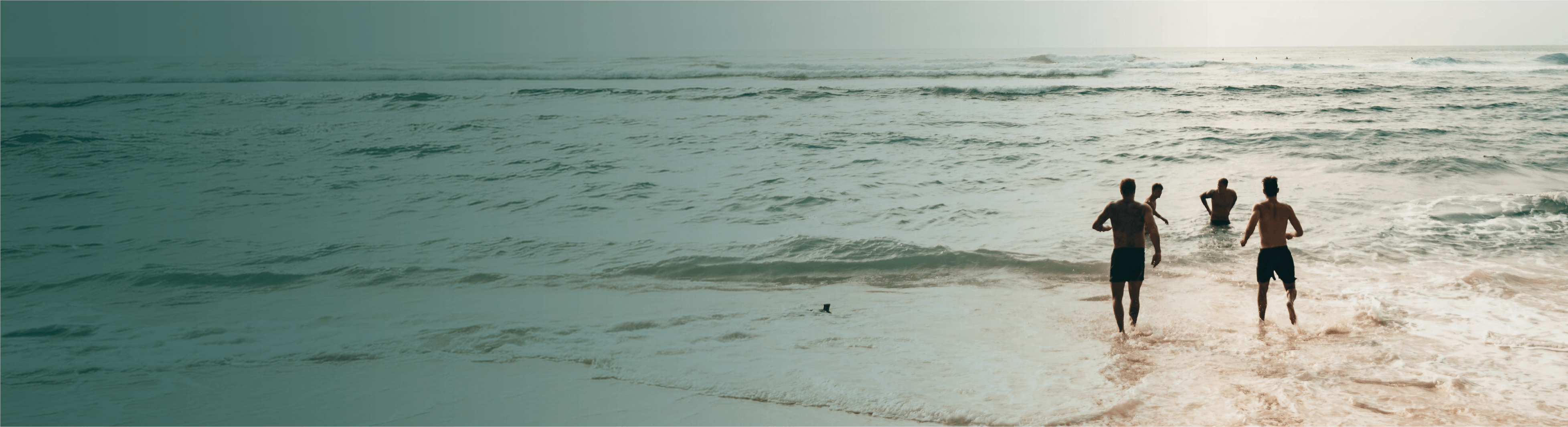 People on beach at sunset