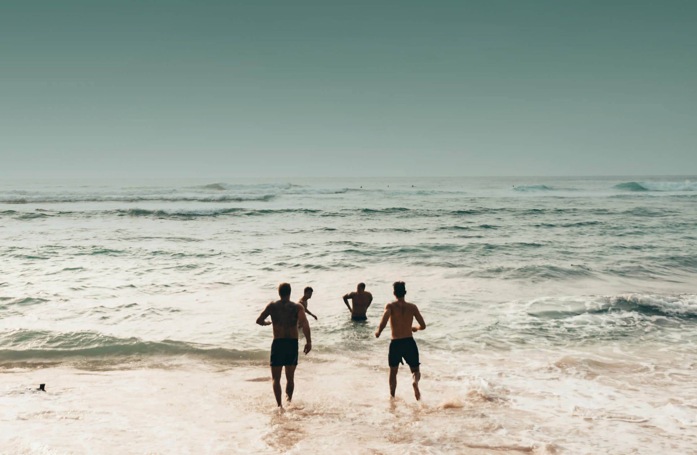 People on beach at sunset